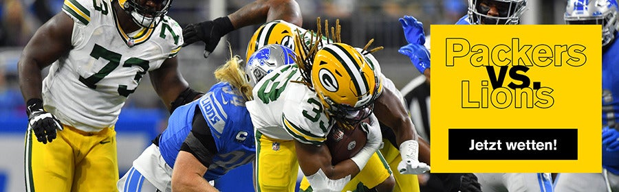 Ein Green Bay Packers Spieler wird von einem Detroit Lions Spieler getackelt.