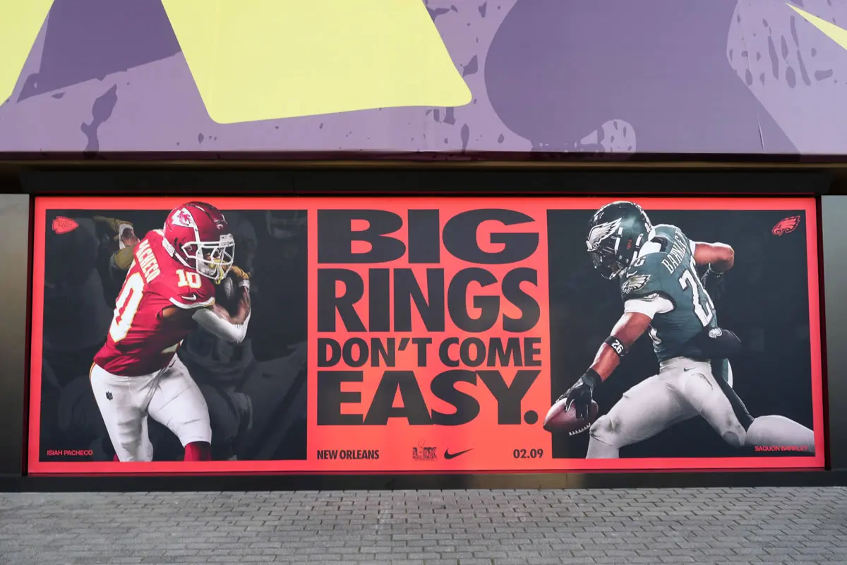 Super Bowl LIX advertisement with images of Kansas City Chiefs running back Isiah Pacheco (left) and Philadelphia Eagles running back Saquon Barkley at the Caesars Superdome. New Orleans Louisiana United States.