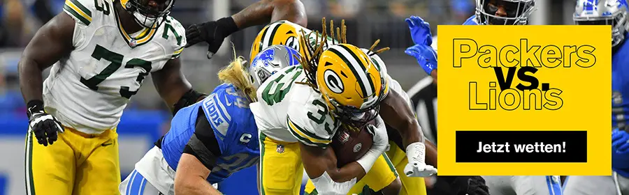 Ein Green Bay Packers Spieler wird von einem Detroit Lions Spieler getackelt.